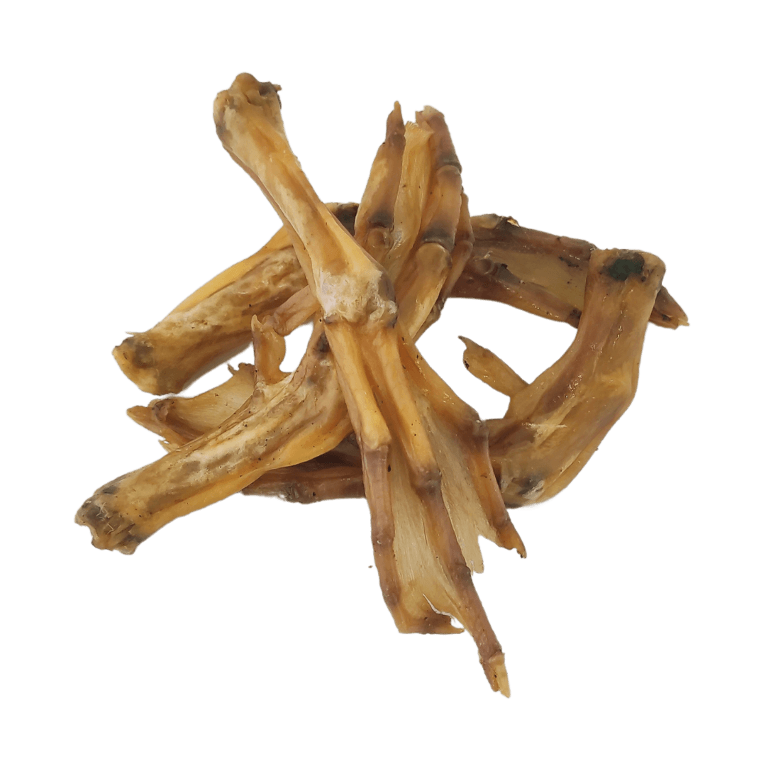 Four air-dried duck feet natural dog treats interlocked together on a white background.