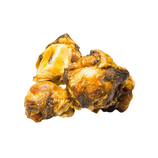An image of two beef knee natural dog treats on an all white background.
