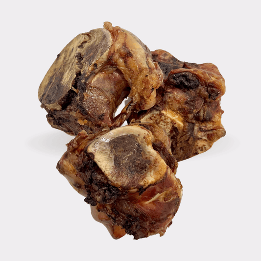 British beef knuckle bone natural dog treats on an all white background.