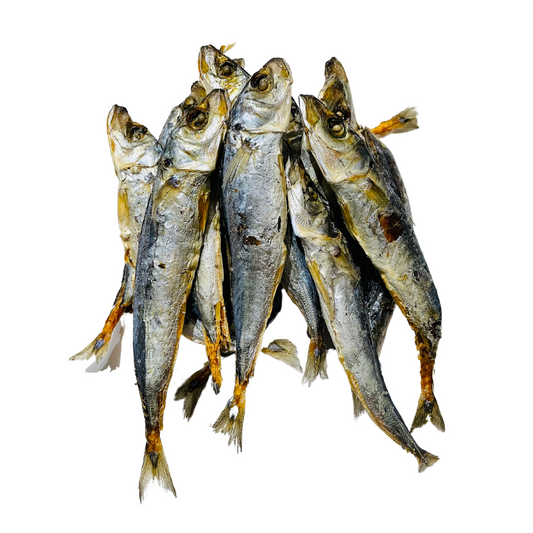 A school of dried sprats fish natural dog treats on an all white background.