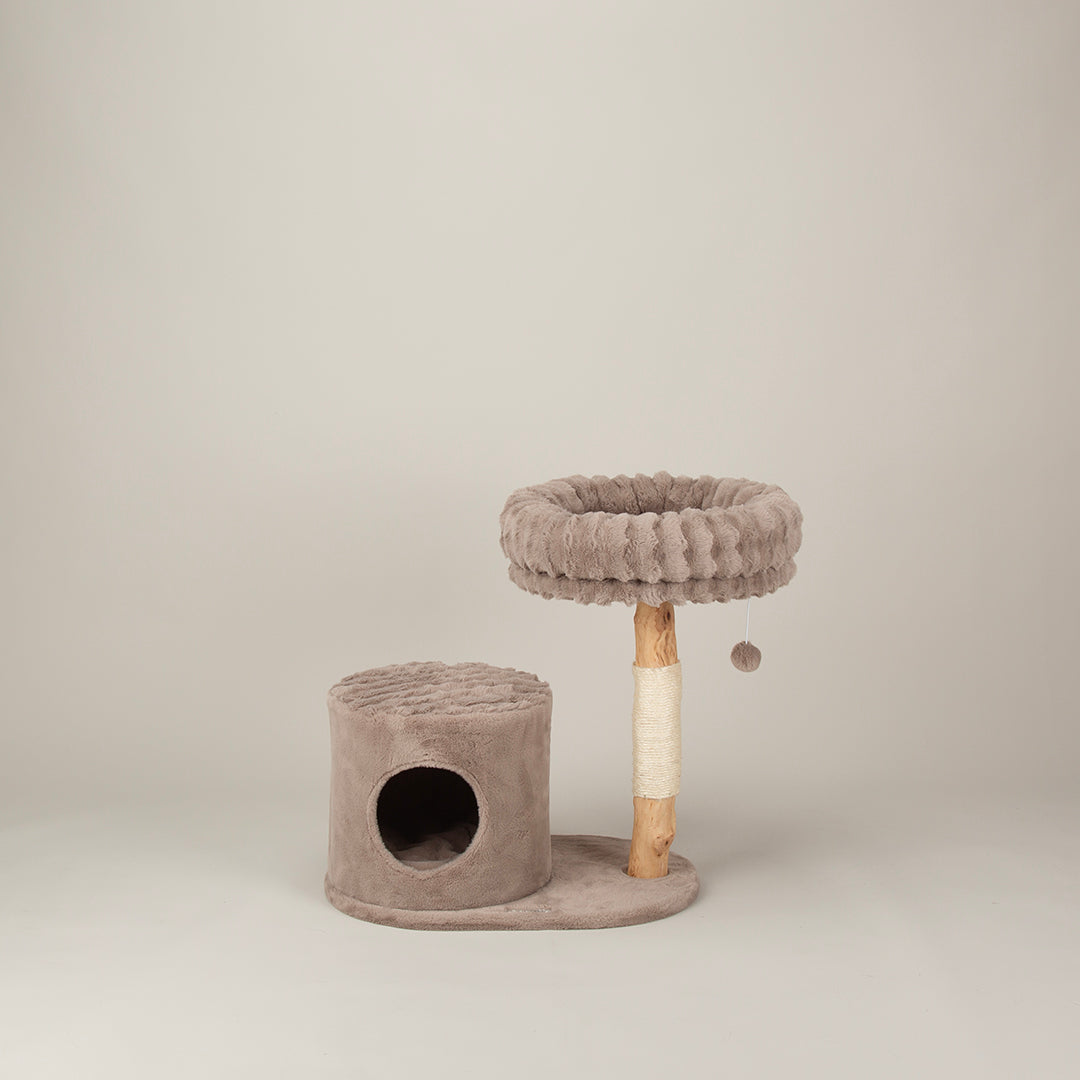 Cat tree with round platform and cylindrical base on a beige background