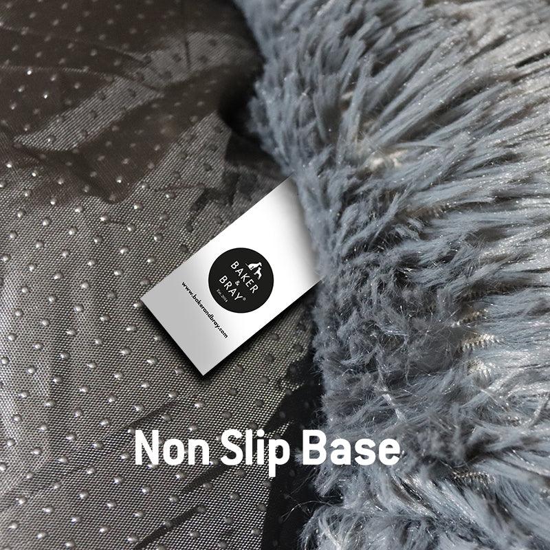 Close up of Baker & Bray dark grey calming donut dog bed showing non slip base