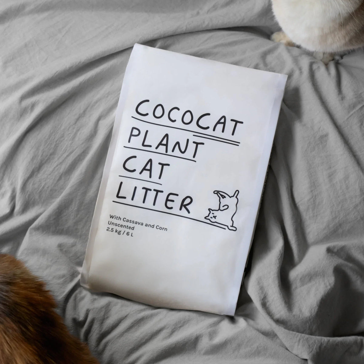CocoCat Cassava Cat Litter bag on grey bedding