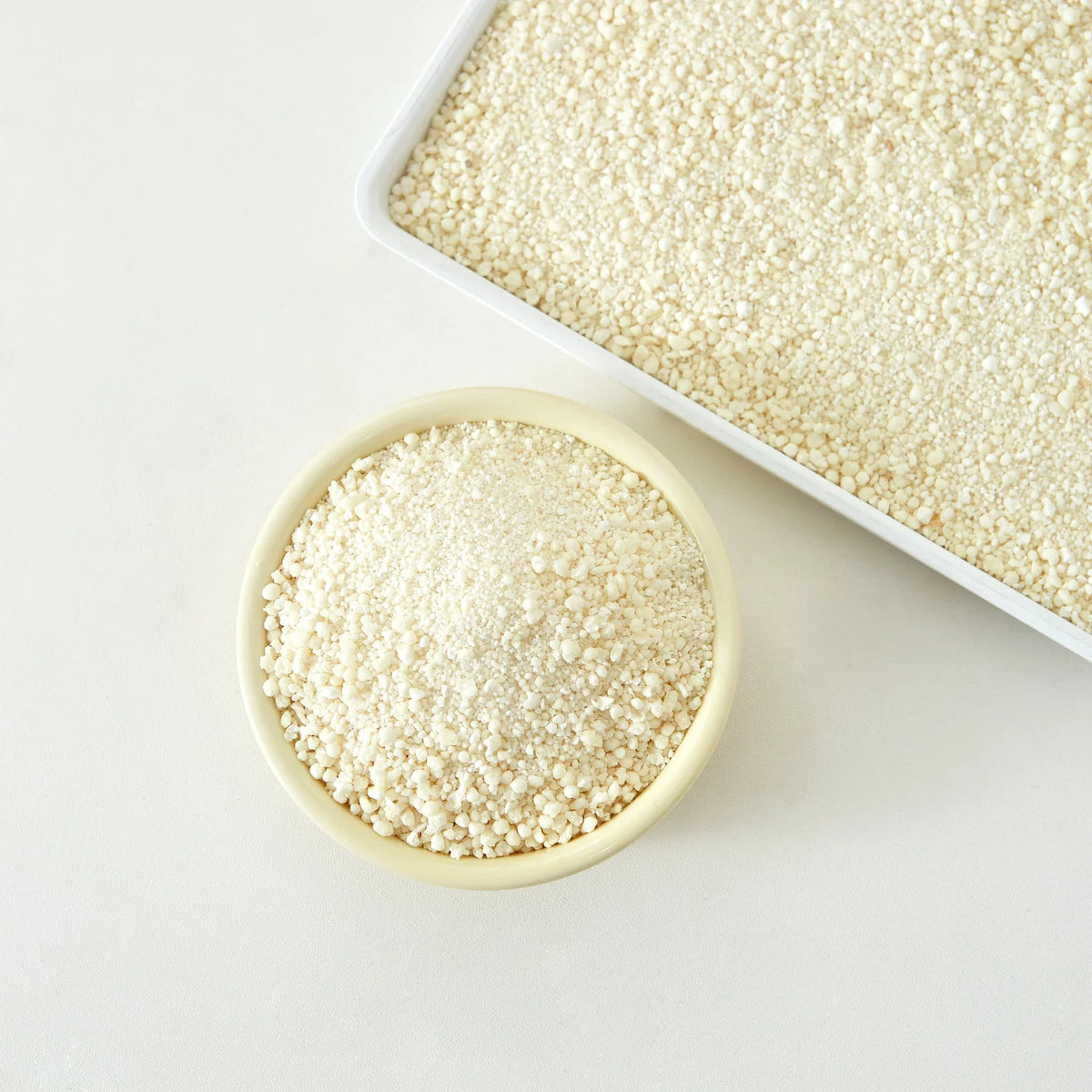 Close-up of CocoCat cassava cat litter granules in a dish