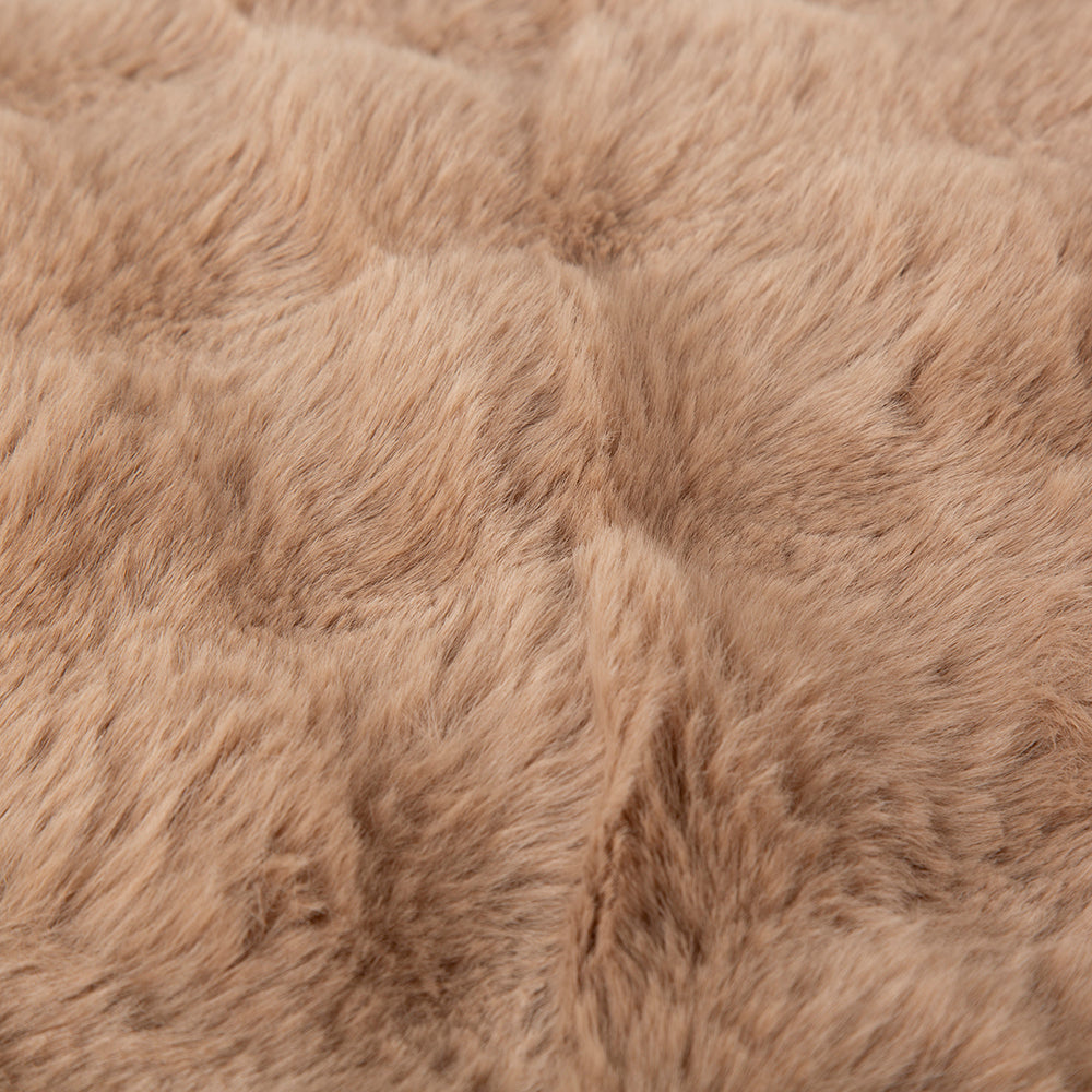 Close-up of brown fur texture on a dog mattress