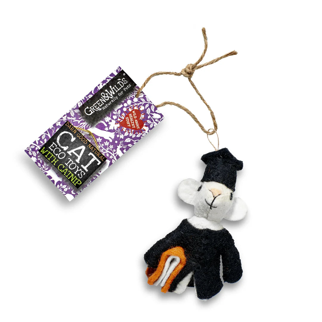A black and white eco cat toy resembling a mouse, with a attached jute string, displayed next to its packaging which has 'Green & Wild's' branding.