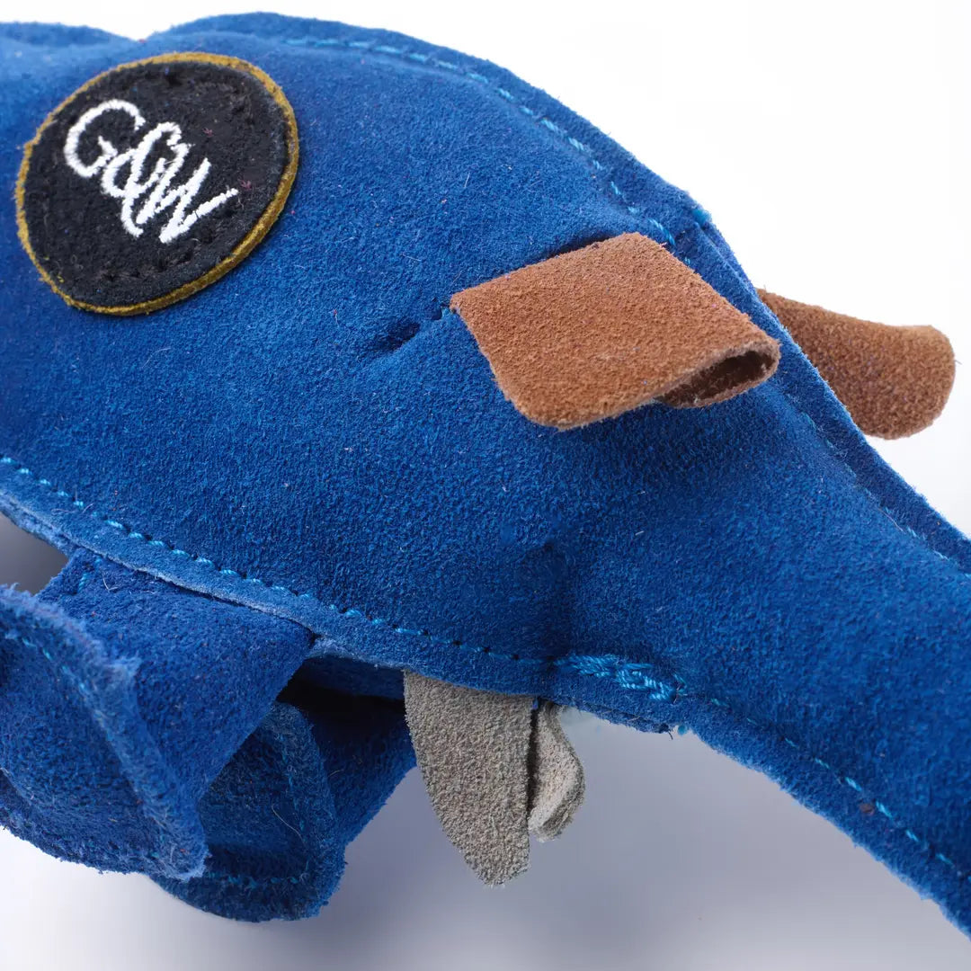 A close up of a blue suede eco dog toy with a G&W logo on its side.