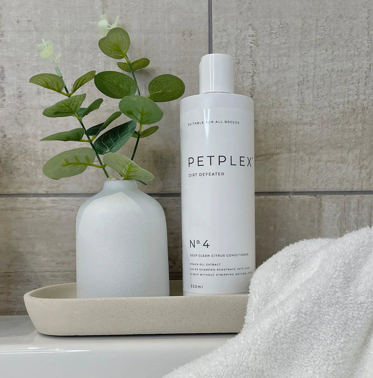 PetPlex No. 4 Deep Clean Citrus Dog Conditioner displayed in a bathroom setting