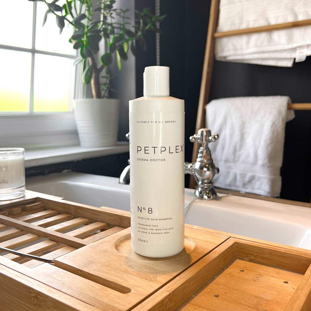 PetPlex No. 8 Derma Doctor Sensitive Skin Dog Shampoo displayed beside a bath in a bathroom setting