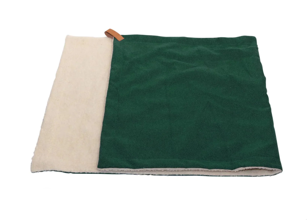 Folded Ralph & Co Richmond luxury dog blanket in bottle green with soft sherpa lining