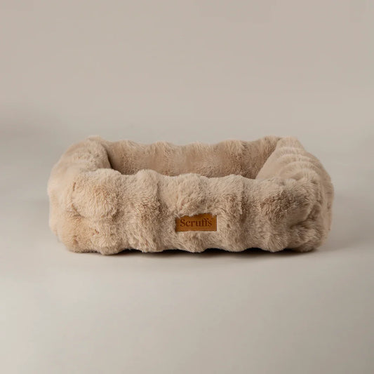 Scruffs Alpine bolster dog bed in champagne faux fur with raised sides