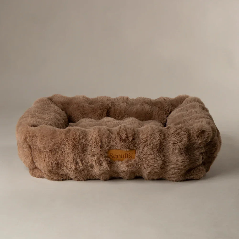 Scruffs Alpine bolster dog bed in taupe faux fur with supportive sides