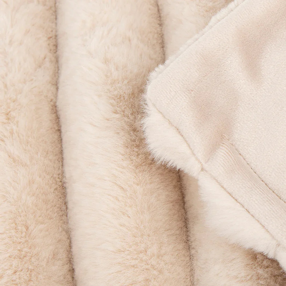 Close-up texture of cream blanket fabric