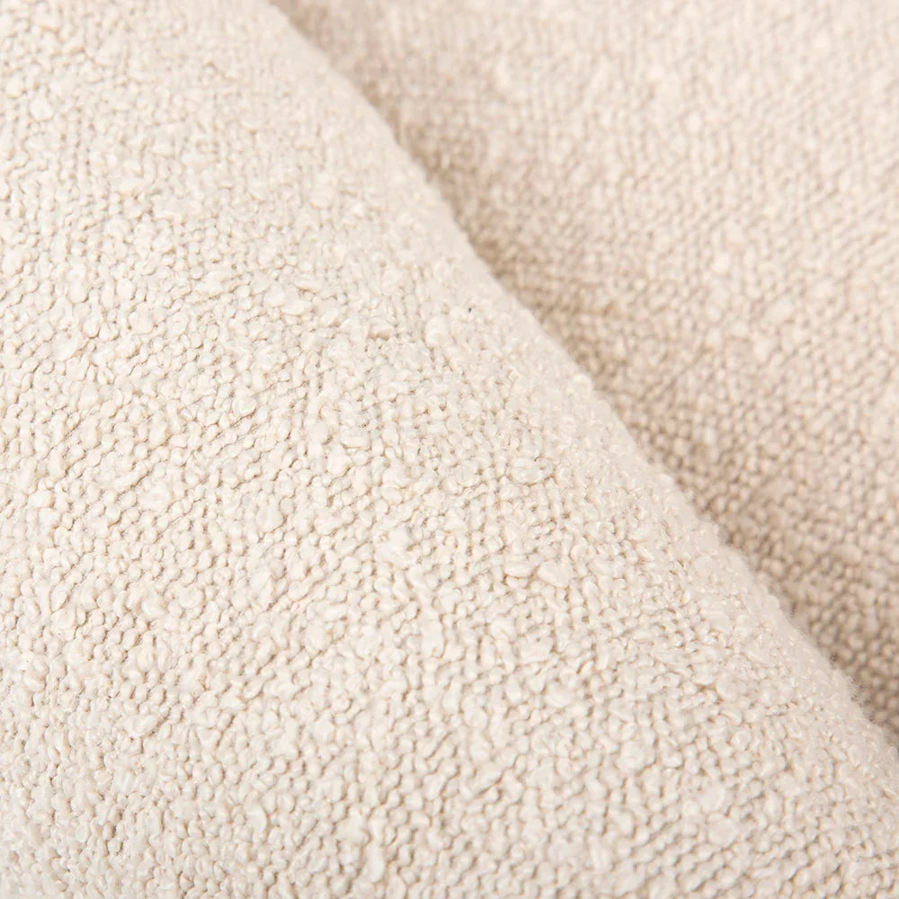 Close up of ivory boucle outer fabric with soft textured finish