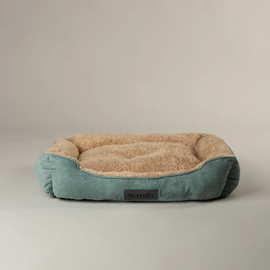 Sage green Scruffs cosy soft-walled dog bed with beige plush interior