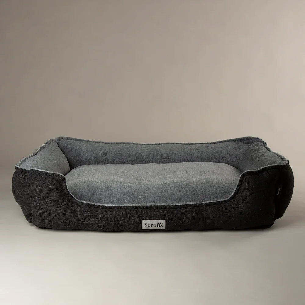 Scruffs Harvard graphite grey memory foam dog bed with raised sides on a neutral background