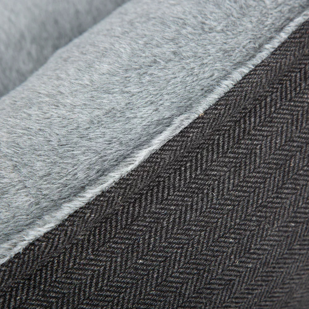 Close up of Scruffs Harvard graphite grey herringbone fabric and plush sleep surface