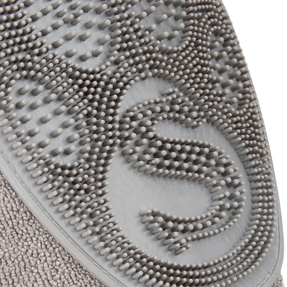 Close-up of rubber grooming comb texture on dog drying mitt